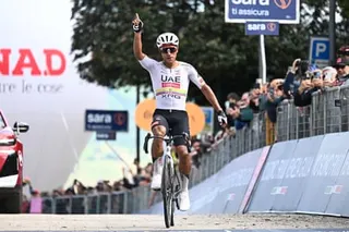 Jhonatan Narváez of UAE Team Emirates XRG raises a finger to the sky as he crosses the finish line in Fermo.