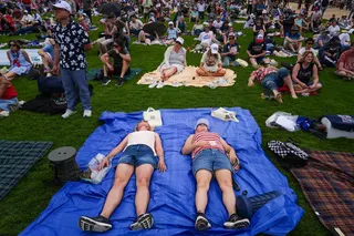 People lay down on the National Mall during Rededicate 250, a mostly conservative Christian prayer gathering in honor of the United States' 250th anniversary, Sunday, May 17, 2026, in Washington. (AP Photo/Julia Demaree Nikhinson)