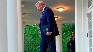 President Donald Trump arriving at the White House Rose Garden for a dinner