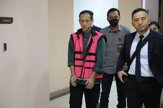 Nadiem Makarim (left) has been charged with committing unlawful acts to enrich himself, others or corporations, causing losses to state finances.