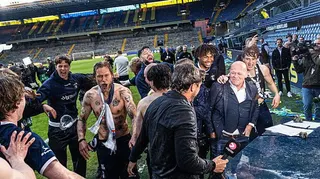 Aarhus GF manager Jakob Poulsen is showered with beer after his team clinch the 2026 Danish league title at Brondby