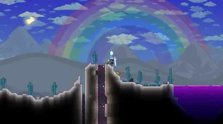 A Terraria character walks in a desert biome that has been overtaken by The Hallow
