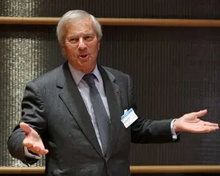 Vincent Bolloré gesturing with palms open wide