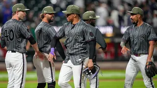 New York Mets' Juan Soto celebrating with Austin Slater on baseball field