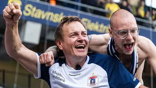 TV correspondent Rasmus Tantholdt celebrates with a fellow Aarhus GF after the team clinches the Danish Superliga title at Brondby in May 2026
