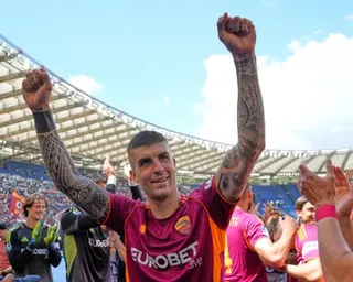 Roma’s Gianluca Mancini greets fans after his double sealed the Rome derby.
