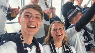 Jakob Emil Beikes and his mother Anja Lilli smiling at Aarhus GF's game at Brondby in May 2026