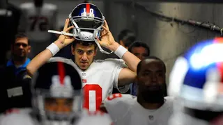 New York Giants quarterback Eli Manning standing in tunnel at Qualcomm Stadium