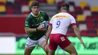 Benhard Janse van Rensburg tries to take on Danny Care during a game between London Irish and Harlequins in 2022