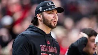 Brendan Sorsby shouting on the sidelines during a basketball game at United Supermarkets Arena
