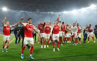 Arsenal players celebrate with the fans after overcoming Atlético Madrid in the Champions League semi-finals
