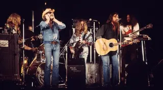 Dr Hook playing in London in 1974, with Locorriere at the right-hand microphone with Ray Sawyer, left.