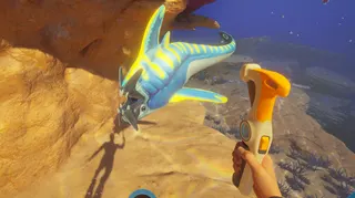 An alien fish being threatened by a hammer