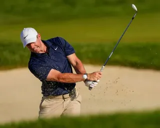 Rory McIlroy plays out the bunker on the 16th during the final round of the US PGA