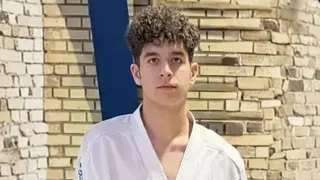 IRAN HUMAN RIGHTS Sasan Azadvar wearing Karate wear, and looking down the lens.