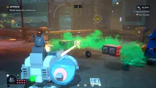 Lego Batman: Legacy of the Dark Knight screenshot showing you in a vehicle ahead of clouds of green toxic fumes