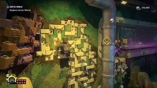 Lego Batman: Legacy of the Dark Knight screenshot showing you scaling a wall as Catwoman