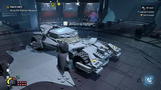 Lego Batman: Legacy of the Dark Knight screenshot showing Batman approaching the batmobile