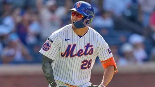 New York Mets' Tyrone Taylor reacting after hitting a home run during a baseball game.