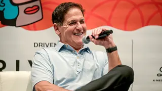Mark Cuban speaking and laughing onstage at SXSW event in Austin, Texas