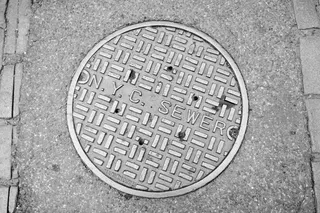 A 56-year-old woman died after she fell into an open manhole in New York. Photo illustration: TNS