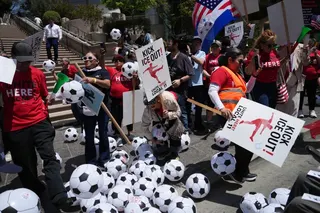 SoFi Stadium workers, belonging to union Local 11, picket outside of the FIFA Los Angeles World Cup 2026 Host Committee headquarters on May Day, Friday, May 1, 2026, in Los Angeles. (AP Photo/Jae C. Hong)