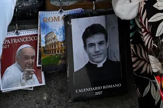 A calendar displaying a picture of Giovanni Galizia dressed as a priest is on sale in a souvenirs shop, in Rome on May 18, 2026. — AFP pic