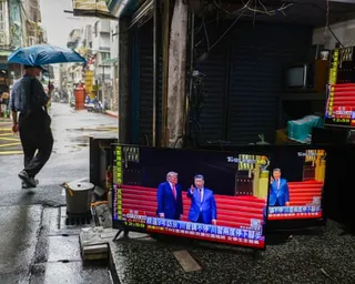 TVs at a repair shop in Taipei, Taiwan, broadcasting the Beijing meeting between Trump and Xi.