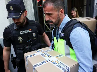 Police officers carry boxes from the office of former Spanish prime minister Jose Luis Rodriguez Zapatero in Madrid on Tuesday. Photo: Reuters