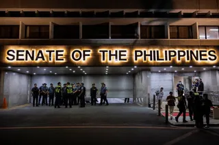 Police officers stand outside the Senate building