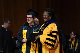 Billie Jean King poses with her diploma