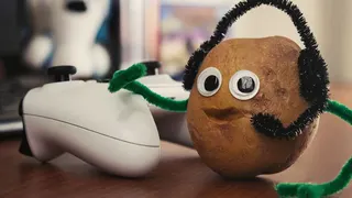 A potato with eyes and a mouth and a headset