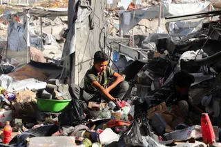 Palestinians inspect the site of an Israeli strike on a house that was pre-warned by the Israeli military to evacuate before the strike was carried out late on Monday, in Jabalia refugee camp in the northern Gaza Strip May 19, 2026. REUTERS/Ebrahim Hajjaj