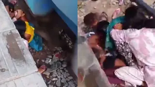 列车疾驶而过 印度母紧护两孩并助两女子逃生