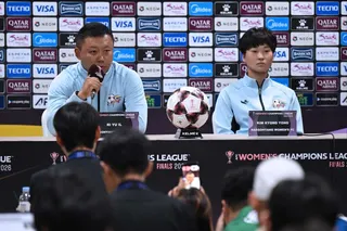 Naegohyang Women’s FC head coach Ri Yu Il (left) and player Kim Kyong Yong answer questions at a press conference at Suwon Sports Complex. Photo: AFP