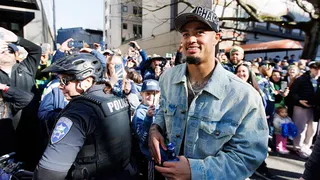 Seattle Seahawks wide receiver Jaxon Smith-Njigba looking on during Super Bowl parade