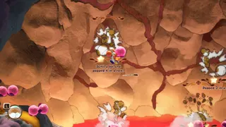 Yoshi and the Mysterious Book screenshot showing you popping bubble-like objects against a rocky backdrop