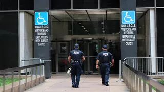 Members of the NYPD Strategic Response Group entering 26 Federal Plaza in New York
