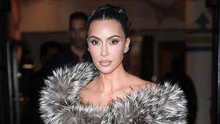 Kim Kardashian wearing a dress with fur-trimmed neckline in New York City