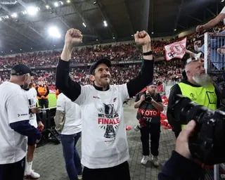 Julian Schuster celebrates after Freiburg reach the Europa League final.