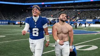 Jaxson Dart and Cam Skattebo walking off the field at MetLife Stadium