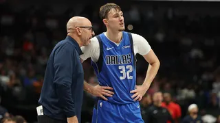 Cooper Flagg speaking with head coach Jason Kidd during basketball game at American Airlines Center