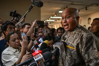 Philippine Senator Ronald dela Rosa talks to reporters at the Senate in Manila