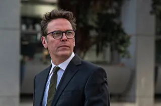 a man looks off to the side