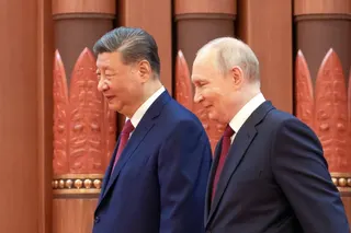 Russian President Vladimir Putin (right) and Chinese President Xi Jinping (left) walk together during their meeting in Beijing on May 20, 2026.  Photo: EPA/ Sputnik/ Kremlin Pool
