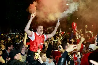 Arsenal fans celebrate their team winning the English Premier League, outside the Emirates Stadium in London on May 19, 2026. — AFP pic