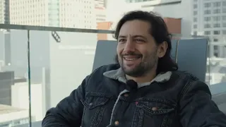 Eric Barone smiling and talking about Stardew Valley