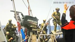 Israeli forces board a boat carrying activists during the interception of the Global Sumud flotilla in the Mediterranean Sea.
