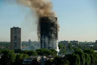 The tower in flames in 2017. The block was home to hundreds of residents. Photo: AP