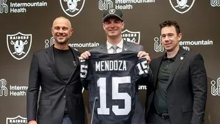 Quarterback Fernando Mendoza posing with Raiders general manager John Spytek and head coach Klint Kubiak at a news conference